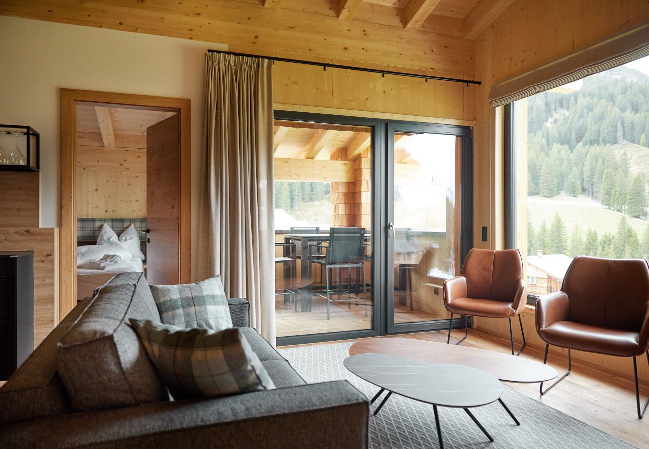 Woonkamer Alm Lodge 1 Bank met twee fauteuils