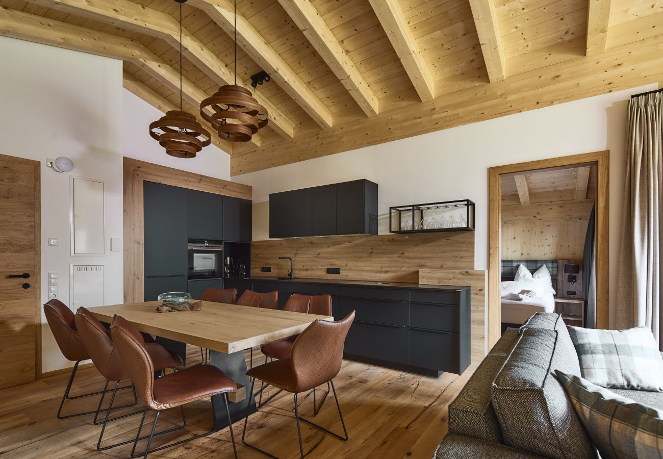 Living room Alm Lodge 1 Kitchenette with table and 7 chairs Alm Lodge 1