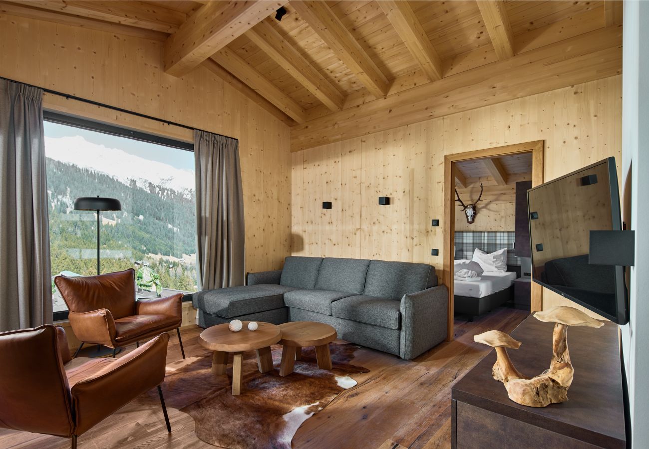 Living room Alm Lodge 8 Living area with sofa and armchairs in Alm Lodge 8