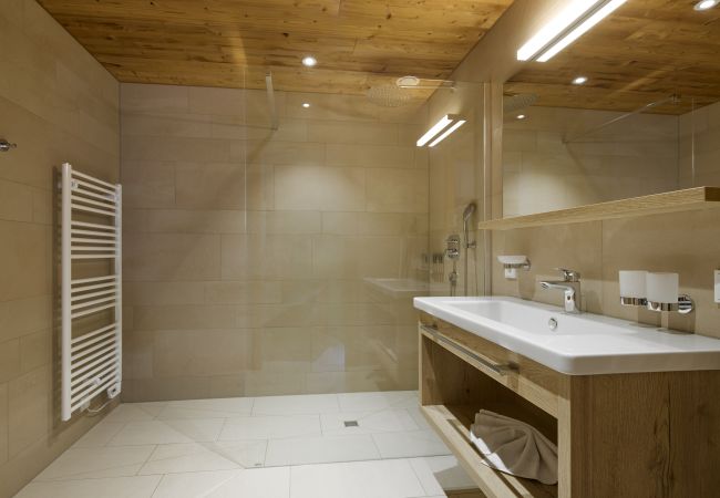 Bathroom Bartgeier 111 Alpin-Resort Montafon Bathroom with shower and sink in Bartgeier 111 Alpin-Resort Montafon