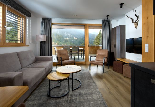Living room Bartgeier 111 Alpin-Resort Montafon Living room with sofa and armchairs in the Bartgeier 111 Alpin-Resort Montafon