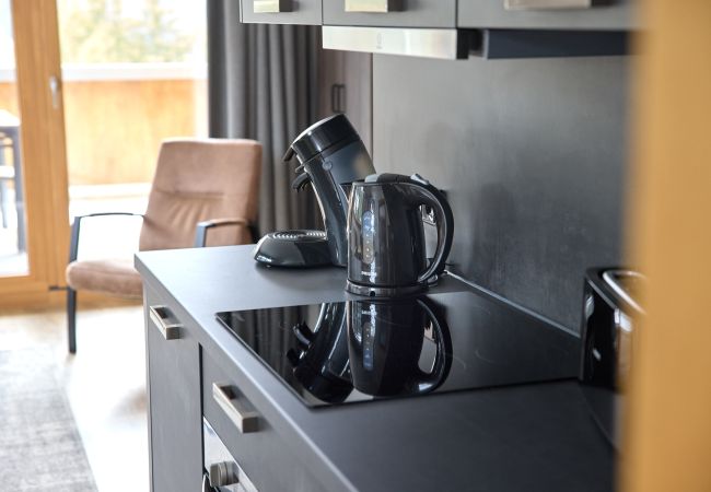 Kitchen Bartgeier 111 Alpin-Resort Montafon Kitchen with coffee machine in the Bartgeier 111 Alpin-Resort Montafon