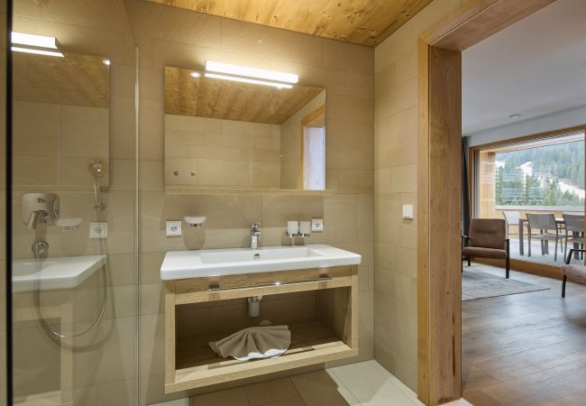 Bathroom Bartgeier 111 Alpin-Resort Montafon Bathroom with shower and sink in Bartgeier 111 Alpin-Resort Montafon