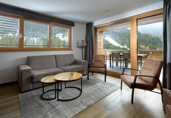 Living room Bartgeier 111 Alpin-Resort Montafon Living room with sofa and armchairs in the Bartgeier 111 Alpin-Resort Montafon