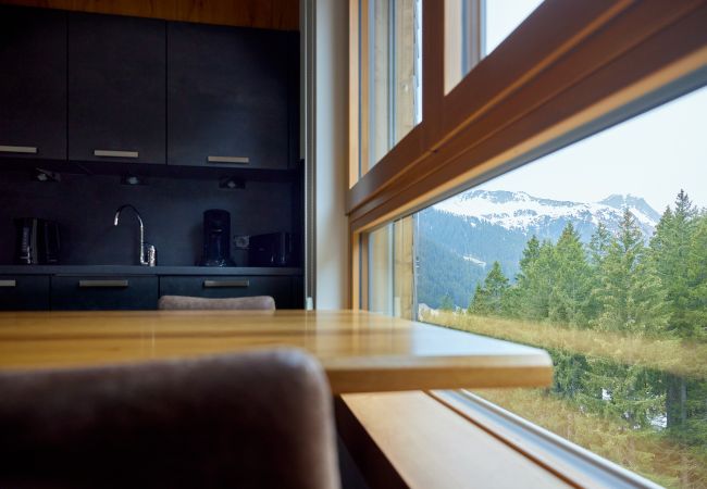 Living room Bartgeier 119 Alpin-Resort Montafon Living area with kitchen and table in the Bartgeier 119 Alpin-Resort Montafon