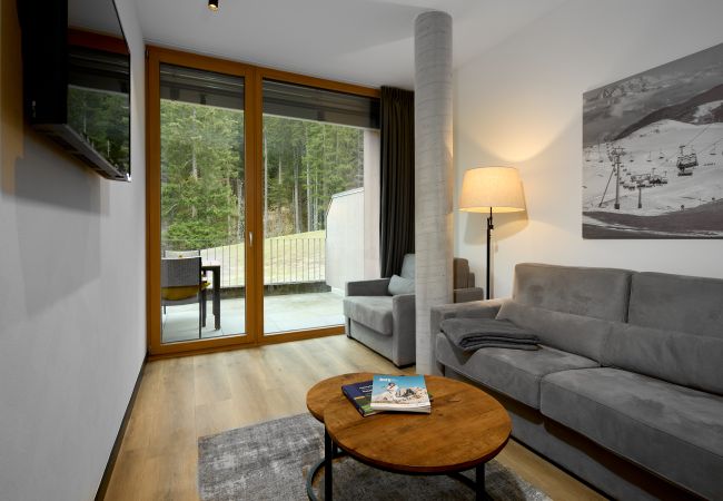 Living area with sofa in the Birkhuhn 301 Alpin-Resort Montafon